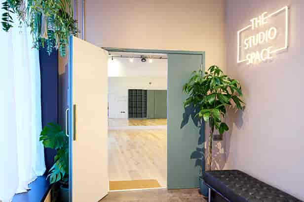 Well-lit Studio 2 entrance with modern decor, perfect for meetings and events.