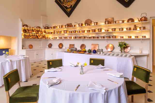 Banquet setup at The Old Kitchen, Badminton Estate featuring elegant copper décor for luxury events.