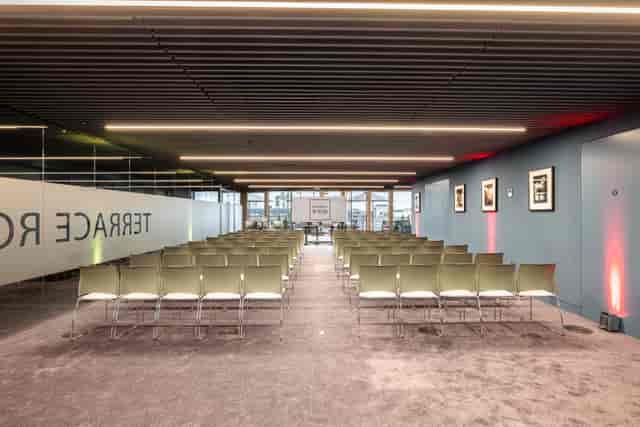 Summer Party Rooftop event space with modern seating and natural light for networking.