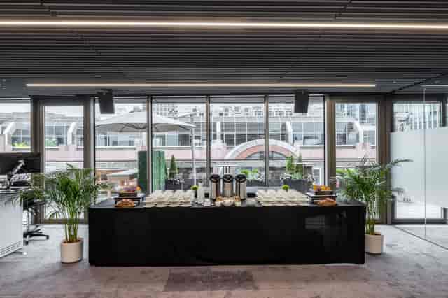 Summer Party Rooftop catering setup with elegant tablecloth for networking events.