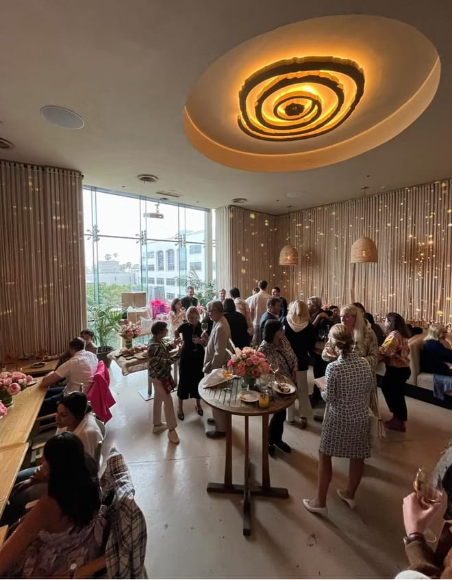 C'est La Vie Private Dining at LouLou: Elegant networking event with floral decor.