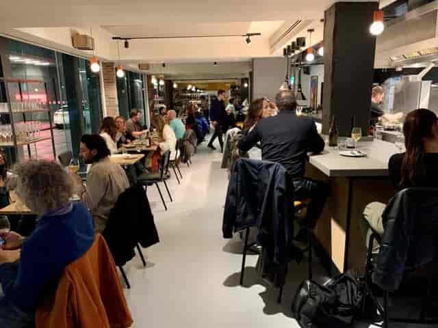 Modern restaurant with bar seating for corporate mixers and boutique networking events.