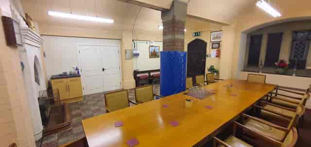 Meeting room at St Anne's Parish Church: Central column in dated, versatile event venue space.
