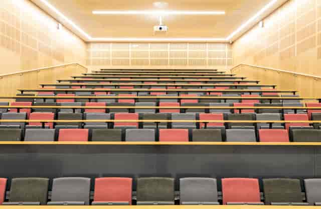 Modern tiered lecture hall, Alliance Manchester Business School for plenary sessions or workshops.