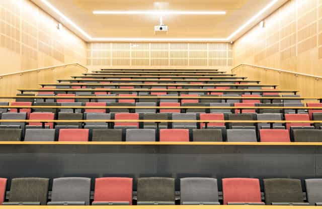 Modern tiered lecture hall, Alliance Manchester Business School for plenary sessions or workshops.