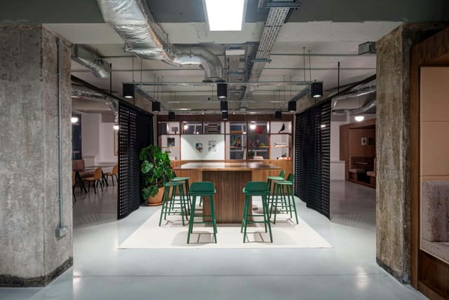 Industrial-chic meeting room for collaborative workshops and agile team huddles.