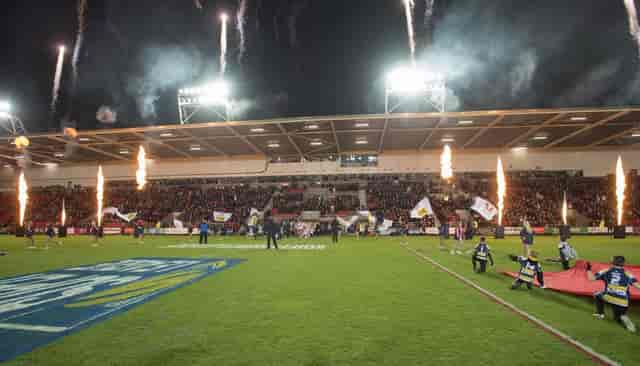 Corporate boxes at Totally Wicked Stadium with pyrotechnics for stadium event branding.