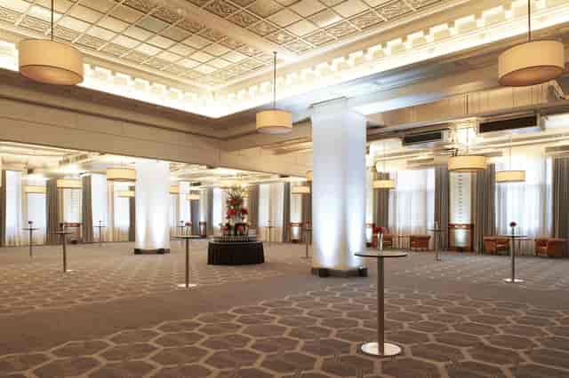 Grand Hall ballroom with uplighting for cocktail reception and corporate event space.