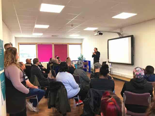 Theater-style training session in Manchester Deaf Centre Oxford Room for corporate event planning.