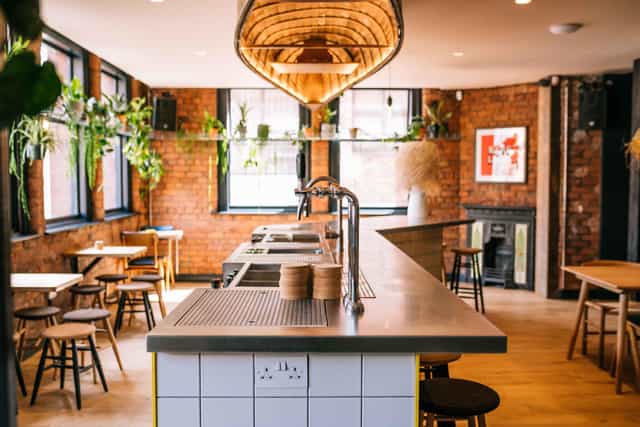 Industrial brick bar for boutique networking events and team workshops.