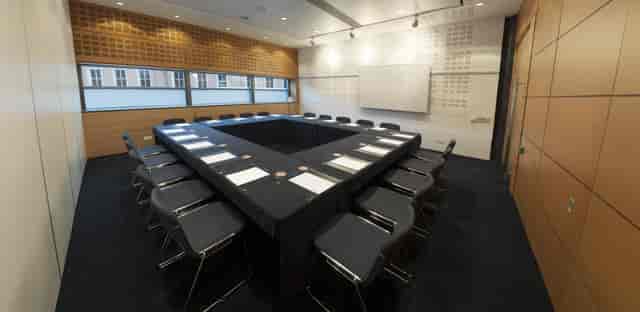 Boardroom meeting space in Manchester Central with hollow square setup for corporate conferences.