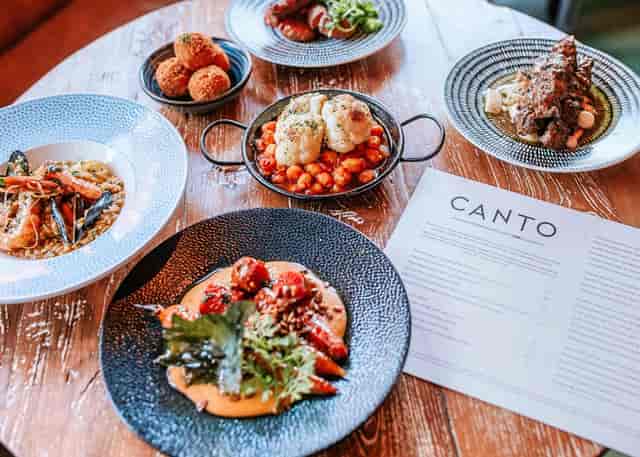 Plated family-style dining at Canto Restaurant for corporate dinner or incentive event.
