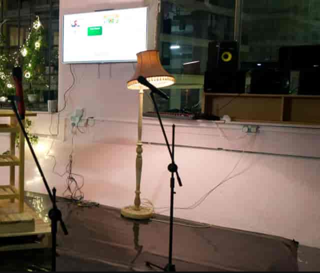 Cluttered AV setup at Shaes London venue, highlighting disorganized equipment and cable management.