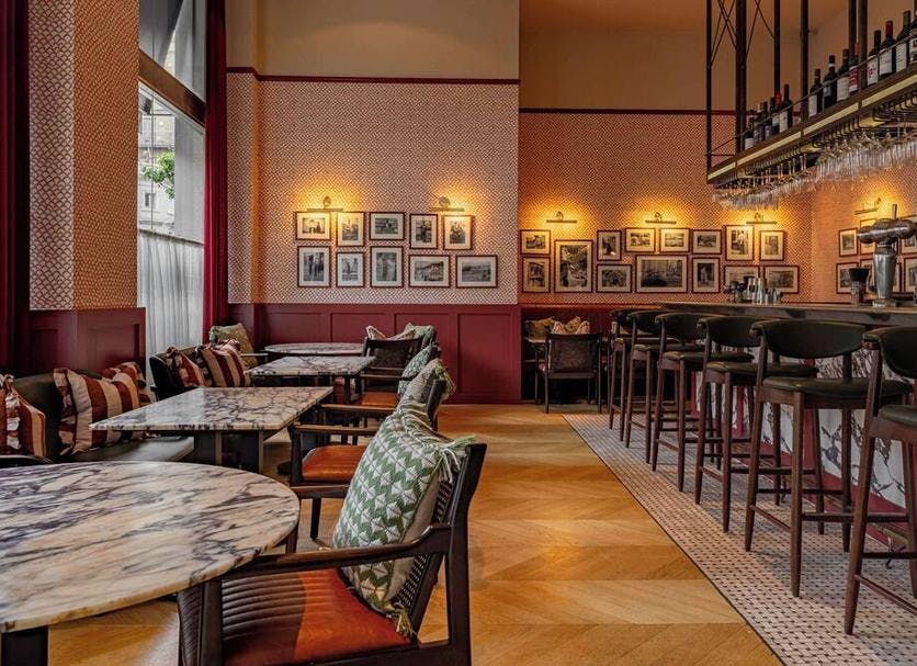 TOZI Restaurant in London: elegant venue with marble tables for networking events.