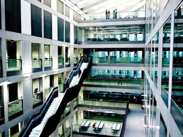 Modern multi-level atrium at Manchester Metropolitan University for corporate events and launches.
