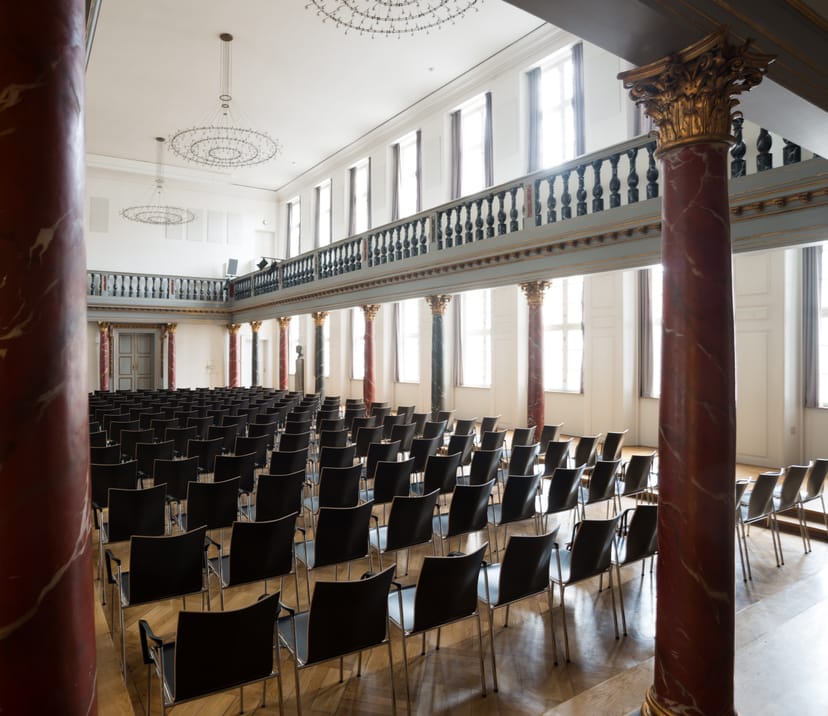 Assembly Hall at National Museum of Denmark: elegant event space with modern seating for gatherings.