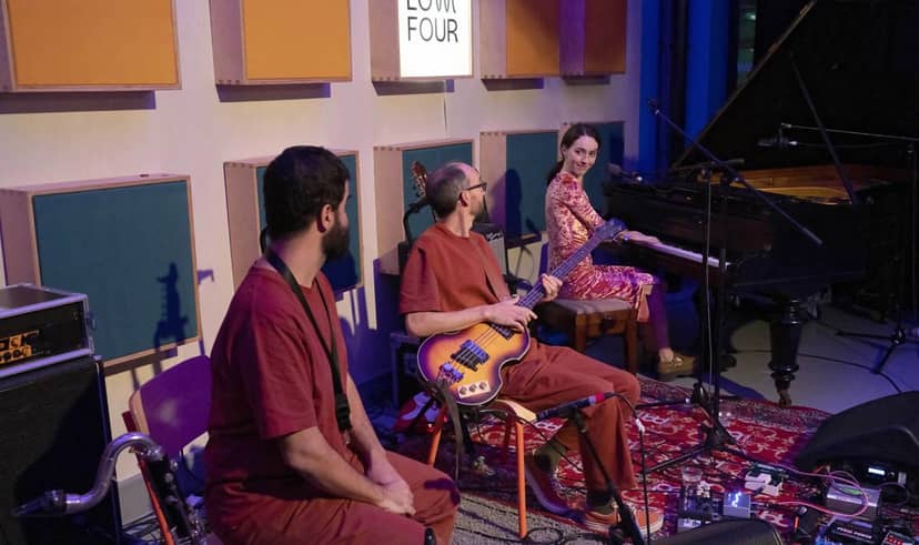 Low Four Studio: intimate live recording session in an acoustically treated production space.