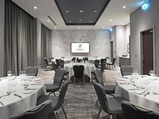 Modern Holiday Inn Manchester banquet room for corporate events and professional conferences.