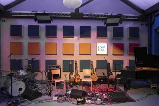 Live music performance stage at Low Four Studio with professional lighting for event production.
