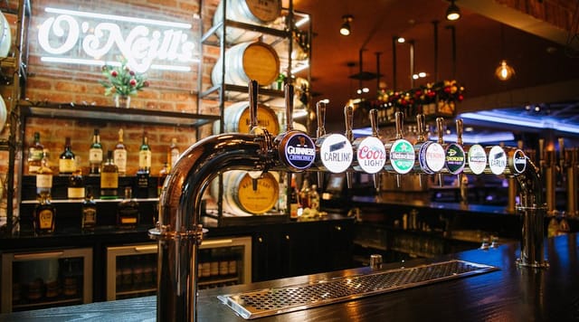 Main Bar at O'Neill's Printworks, perfect for casual networking mixers and social hour events.