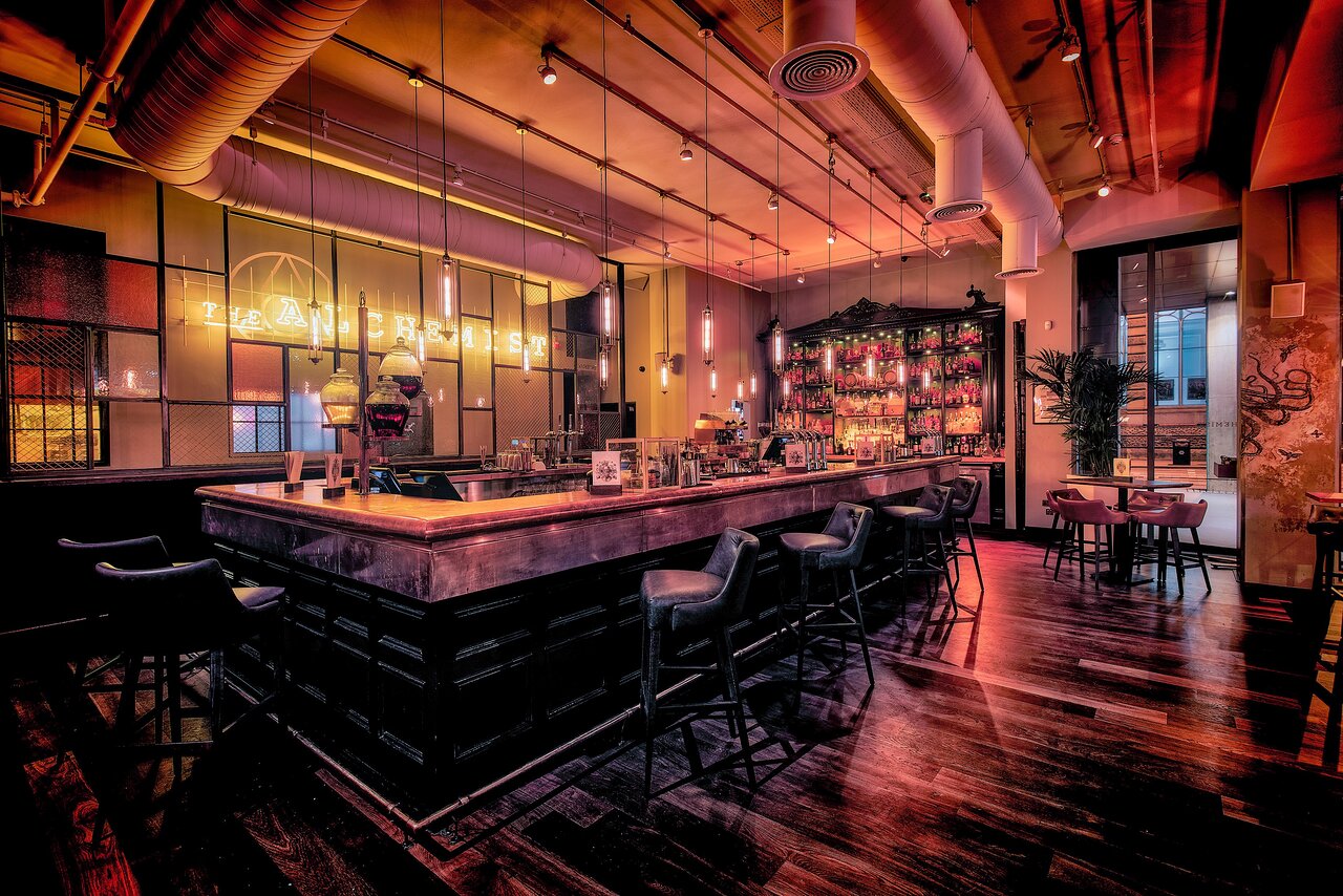 The Alchemist industrial bar interior for intimate corporate networking and evening receptions. - Banner