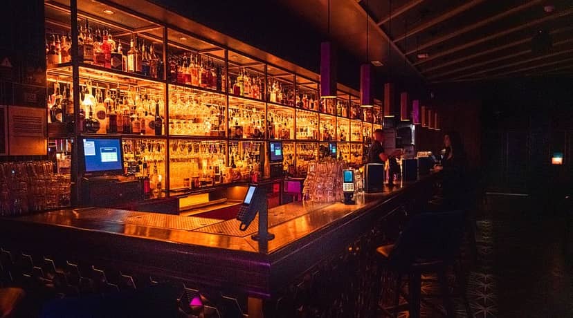 Cocktail masterclass at Be At One Manchester, high-end networking event venue with stylish bar.
