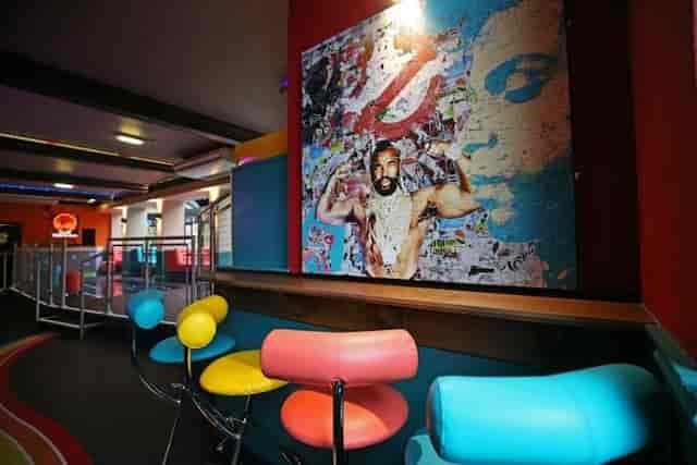 Vibrant Club Tropicana lounge with pop-art decor for creative networking and corporate events.