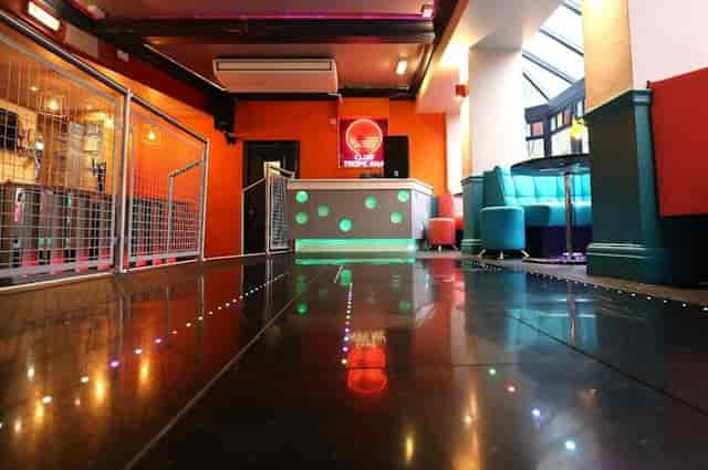 Club Tropicana event space with LED dance floor for cocktail receptions and themed after-parties.