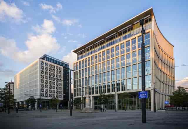 Modern office building with glass facade, ideal for corporate event venue or brand activation.