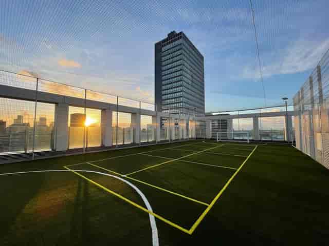 Rooftop gym at Angel Gardens with city skyline, perfect for team building and wellness events.