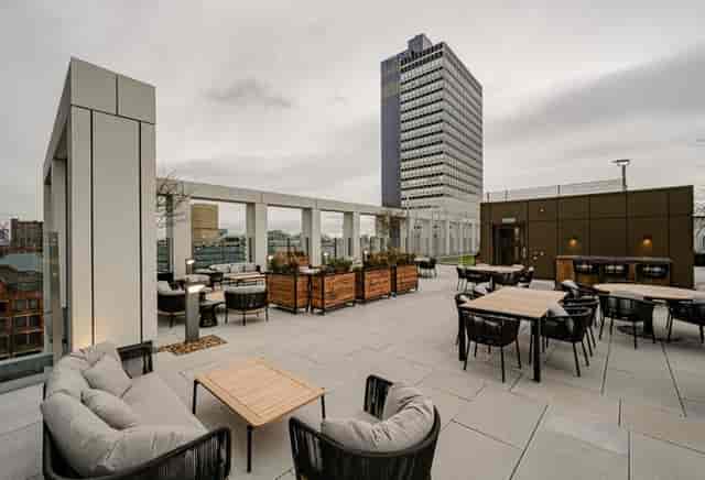Sky lounge rooftop venue with café seating for corporate mixers and networking events.