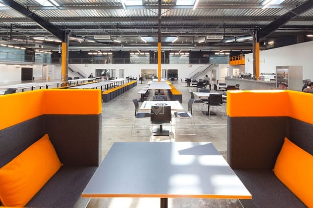 Industrial meeting rooms with flexible layout for networking events and collaborative workshops.
