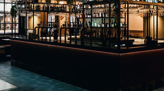 Corporate networking bar with ambient lighting for professional event receptions.