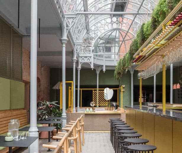 Upscale Winsome restaurant venue with lush greenery for cocktail reception and networking event.