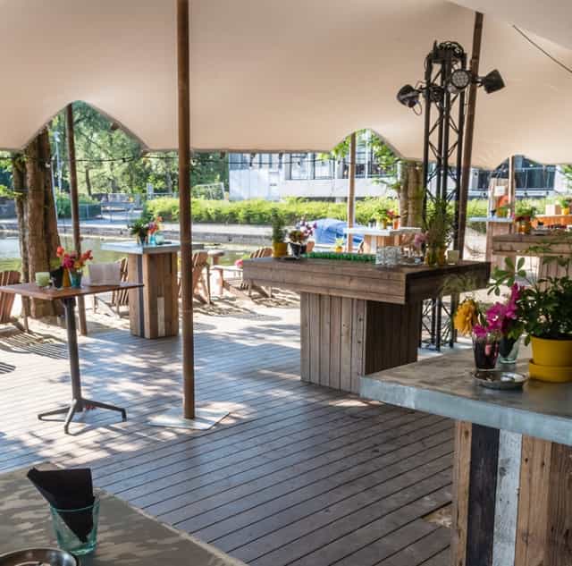 Jetty Bar stretch tent: rustic waterfront venue for networking reception and corporate events.