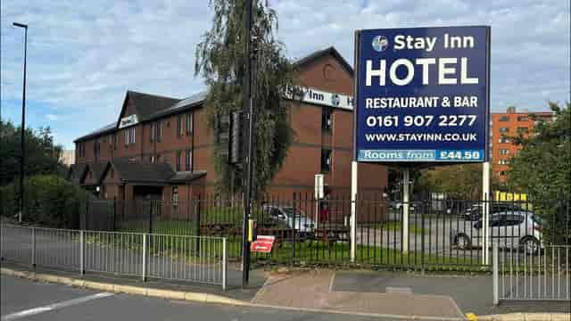 Stay Inn Hotel bar interior, budget lodging for casual travel and social events.