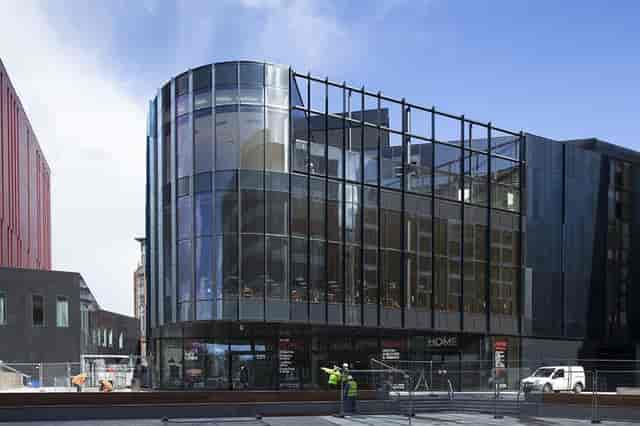 Modern event venue with glass facade, perfect for corporate meetings and social gatherings.
