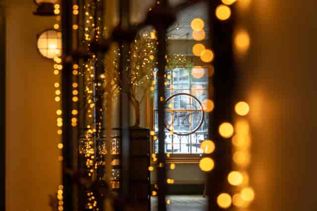 Private dining room at Mowgli Charlotte St with warm string lighting for evening events.