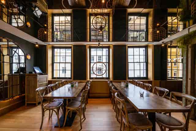 Private dining room with warm lighting for corporate meetings and brand events.