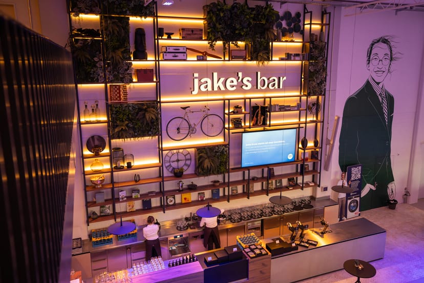 Modern foyer event space with integrated bar for cocktail receptions and networking mixers.
