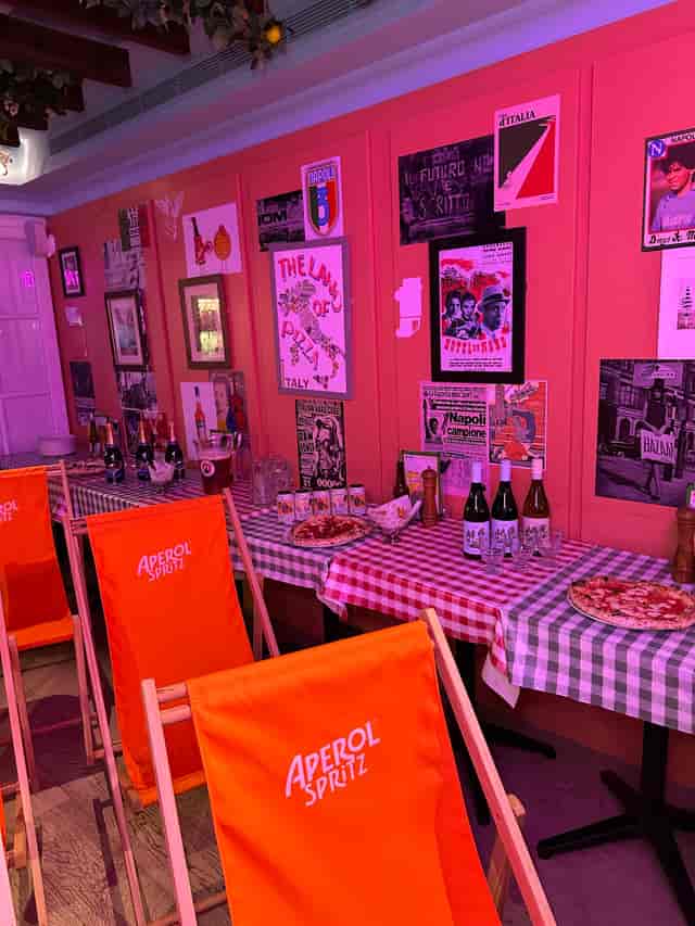 Aperol-themed Cinema Paradiso pop-up, vibrant Italian event space for brand activations.