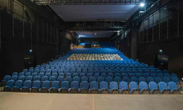 MAAG Halle theater with raked seating for corporate events and plenary sessions.