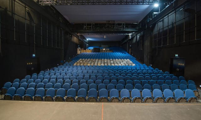 MAAG Halle theater with raked seating for corporate events and plenary sessions.