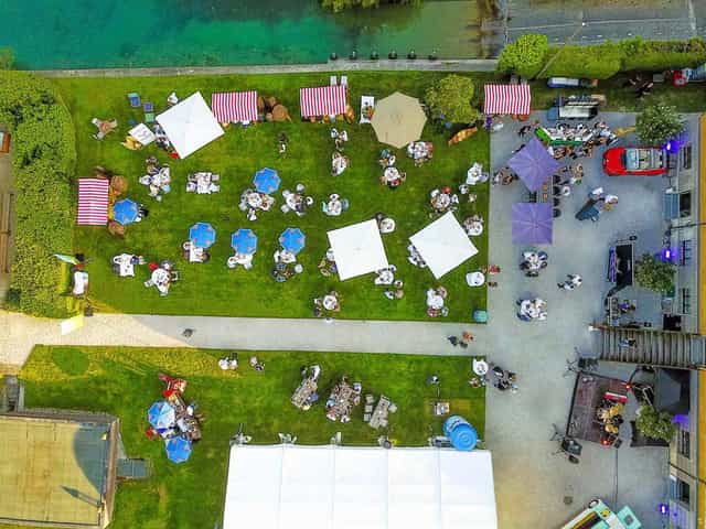 Haus am See garden event venue with banquet seating and lounge areas for outdoor functions.