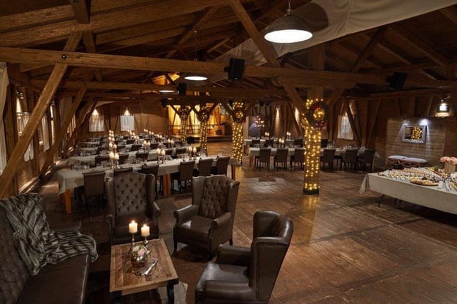 Rustic Eventalm party venue with timber beams for corporate events and themed parties.