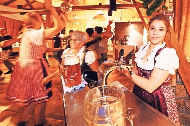Oktoberfest incentive event at Eventalm with Bavarian branding and high-energy dance floor.