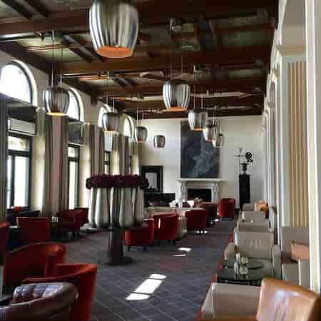 Luxury lounge at The Dolder Grand featuring plush seating for executive networking events.
