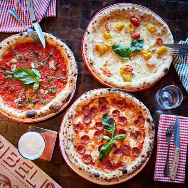 Artisanal pizza at Ribelli Restaurant for networking events and casual corporate dining.