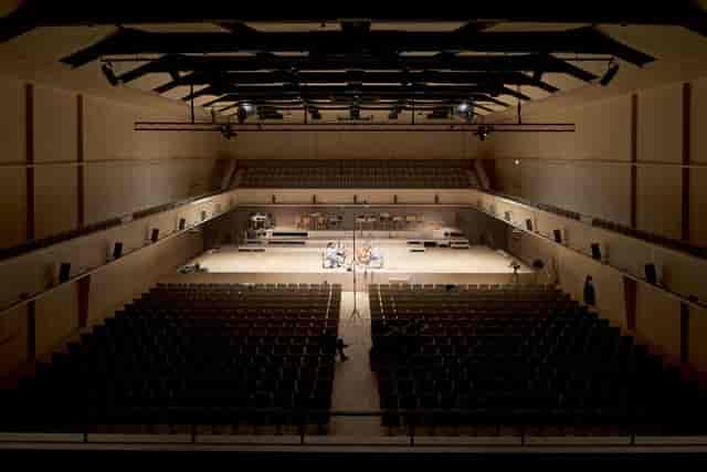 Lichthalle MAAG proscenium stage in low light for keynote events and corporate performances.