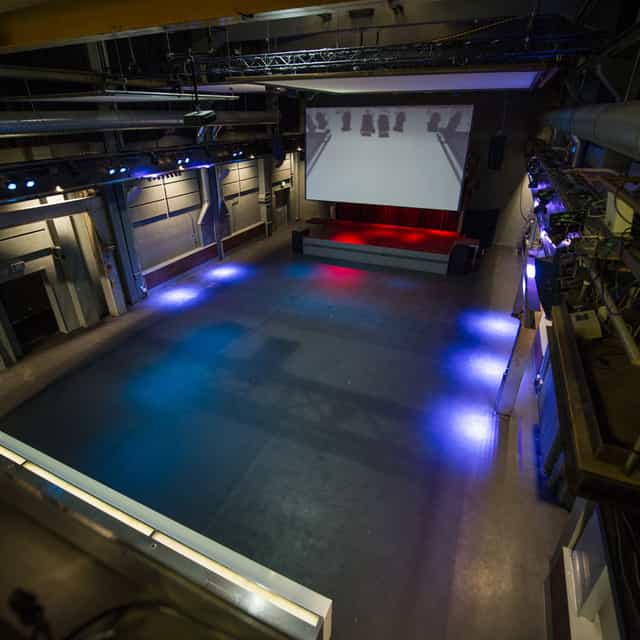 Härterei Club industrial event venue with stage, ideal for corporate conferences and receptions.